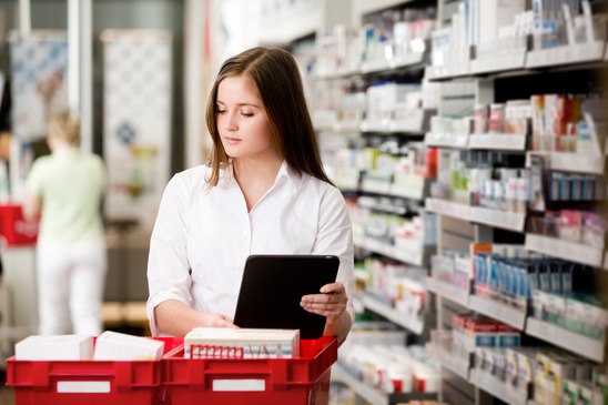 Female Pharmacist Picking Prescriptions