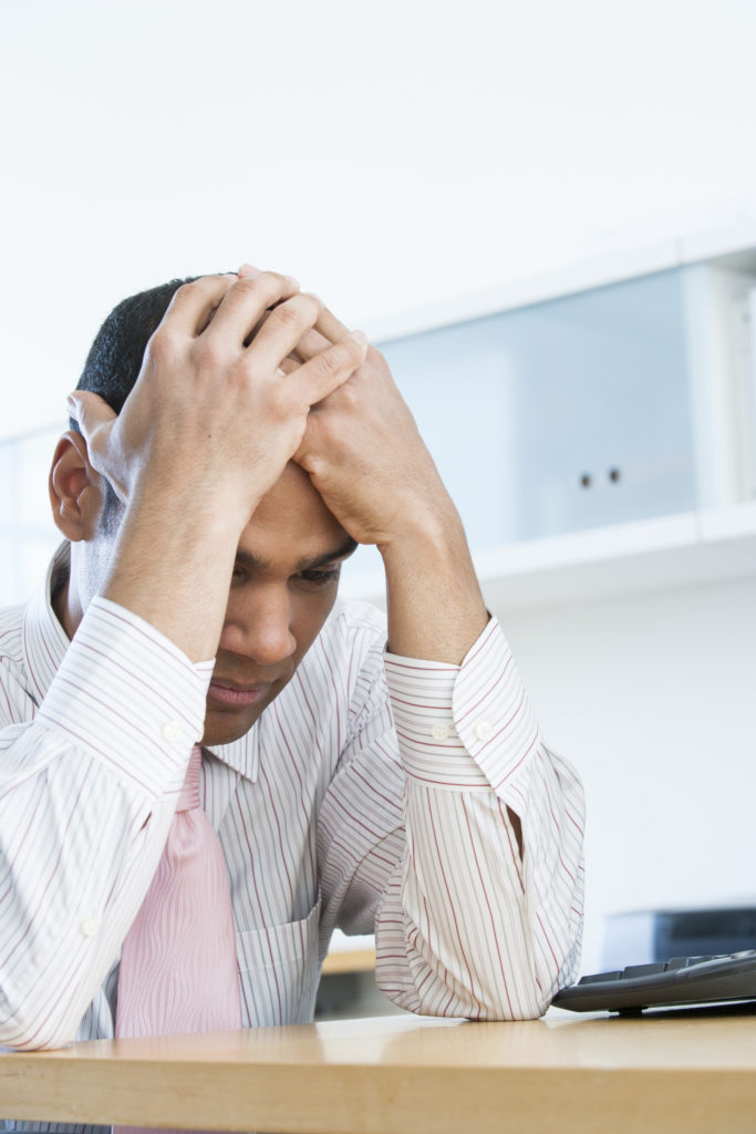 Businessman Experiencing Symptoms of Stress